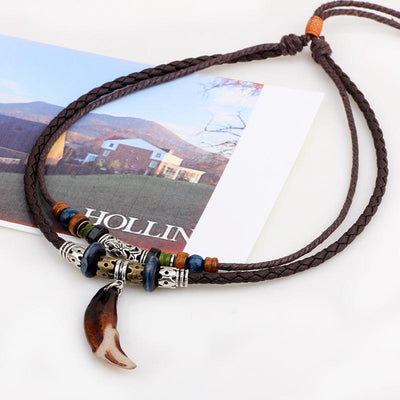 Wolf Tooth Amulet Necklace - Buddha Walks Shop